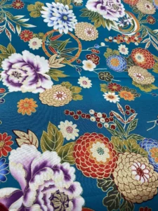 TOIE DE COTON FLEURS SUR FOND TURQUOISE